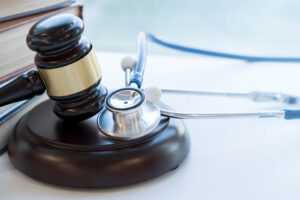 Gavel and stethoscope representing healthcare laws that protect small business owners